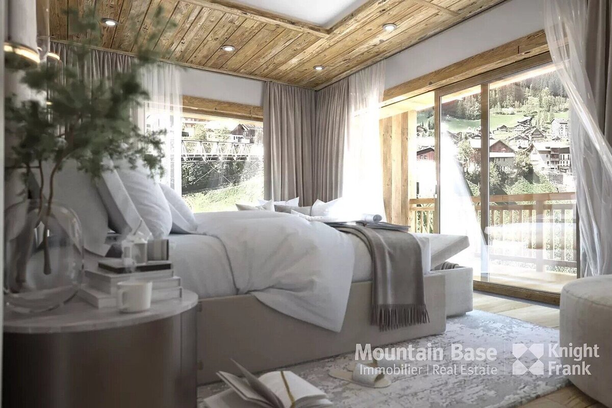 A bright, modern bedroom with a rustic wooden ceiling, neutral tones, and a panoramic view of a charming mountain village through large windows.