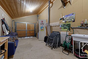A garage with a sign on the door that says no dogs