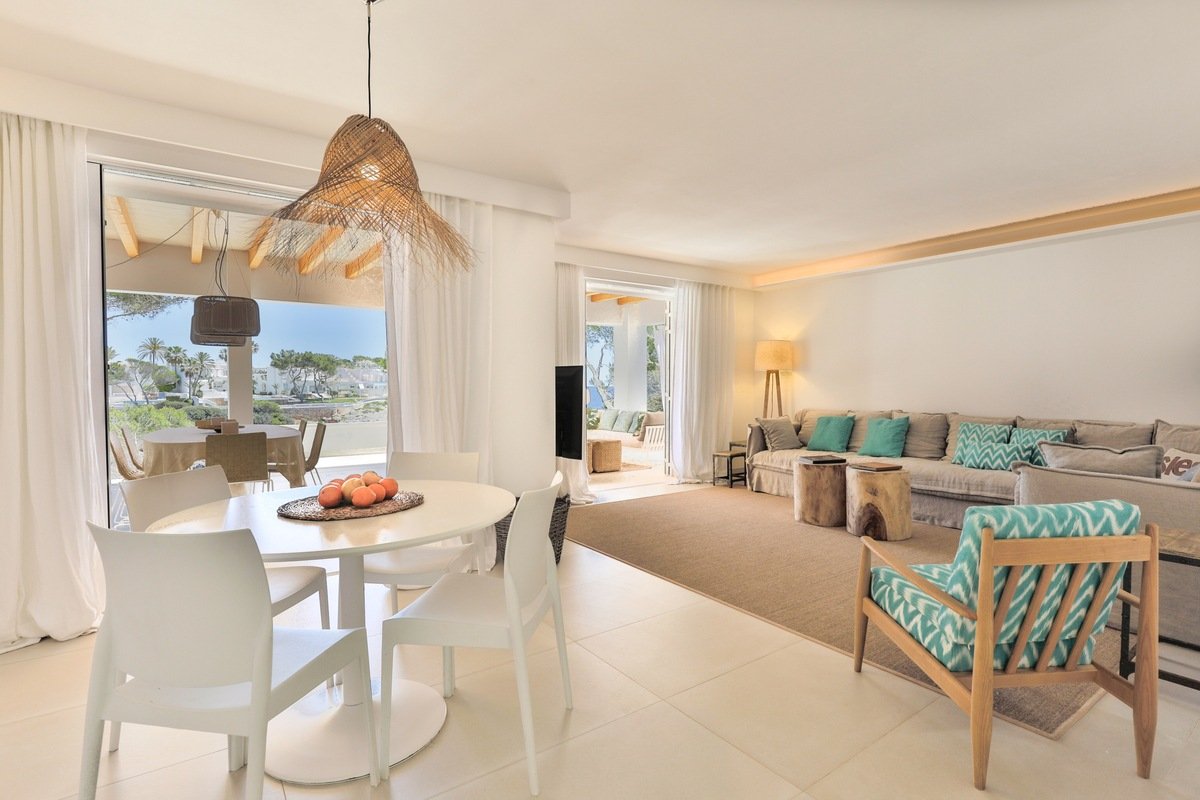 A living room with a table and chairs and a couch