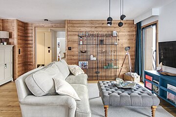 A living room with a couch and a coffee table