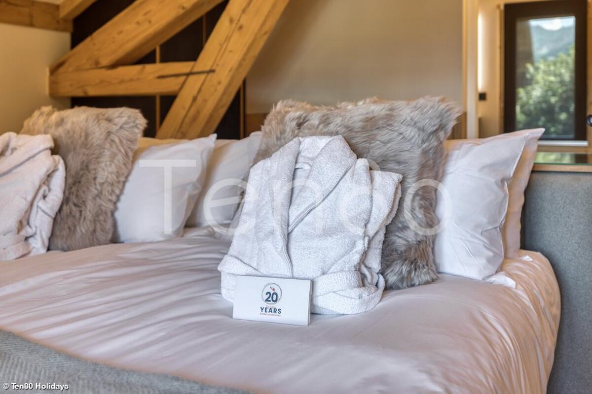 A bed with a sign that says 20 years on it