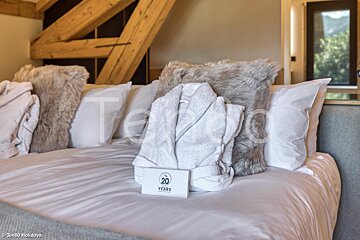 A bed with a sign that says 20 years on it