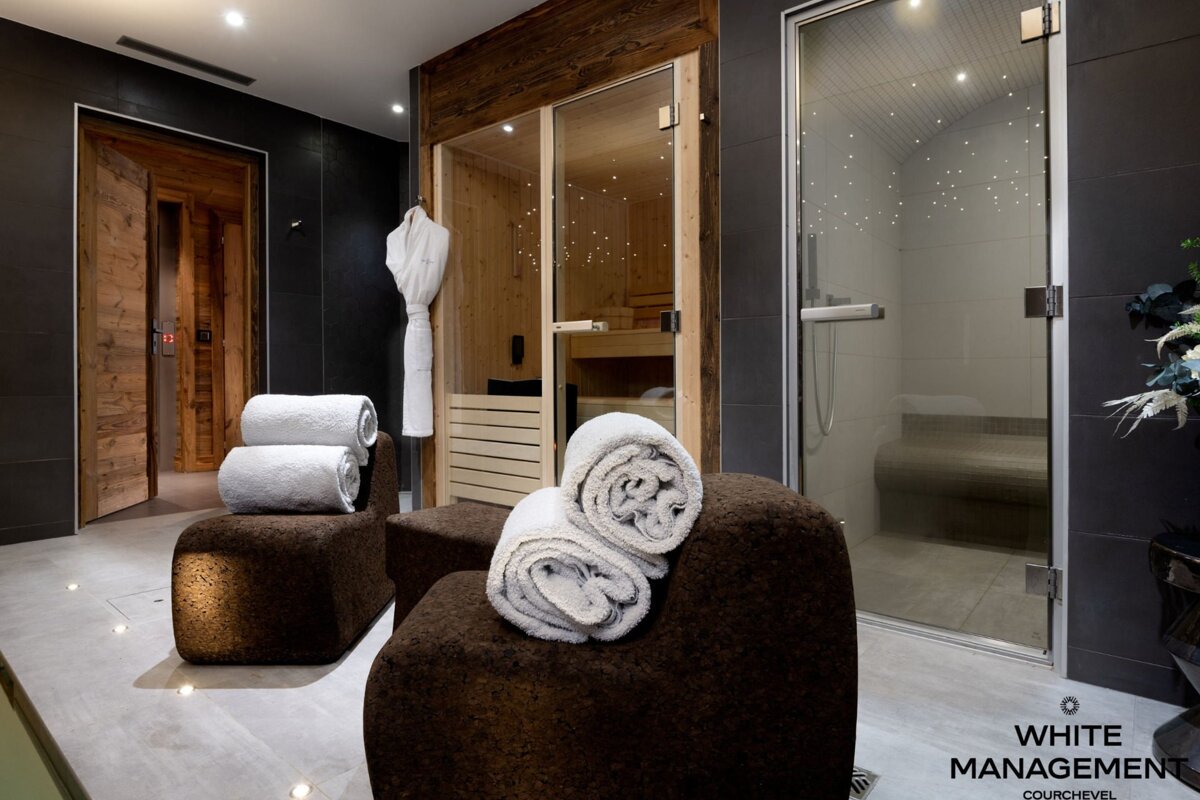 A rental designer luxury rental sign hangs in a bathroom