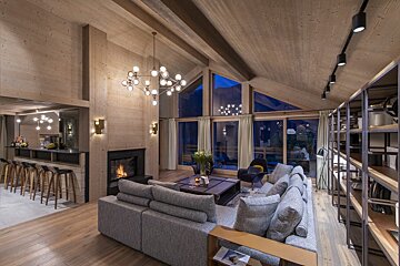A living room filled with furniture and a fireplace