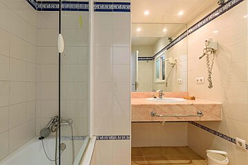 A bathroom with a sink and a bathtub