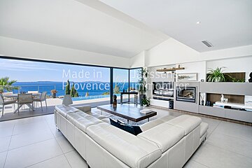 A living room with a couch and a fireplace made in provence