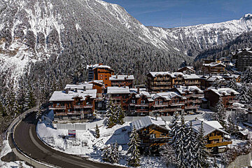 An aerial view of a ski resort in the mountains