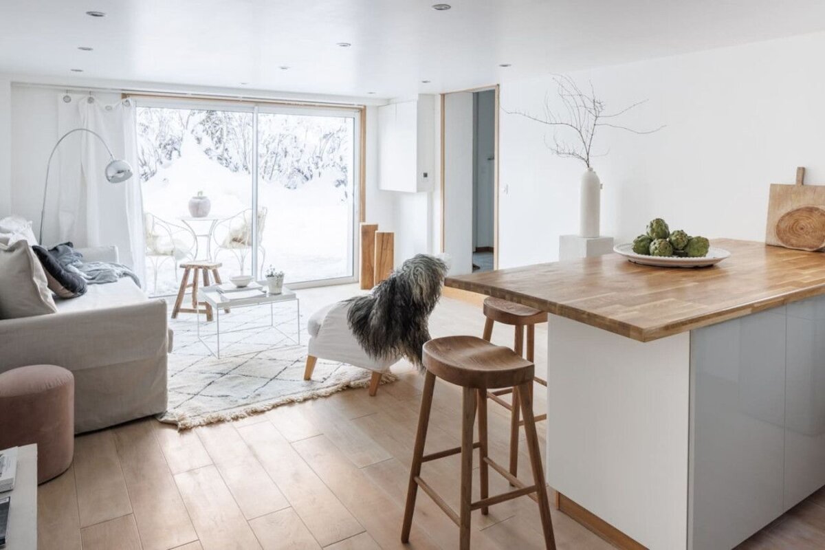 A wooden table with artichokes on it in a living room