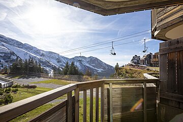 A view of a ski lift from a balcony