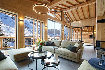A living room with a couch and two coffee tables