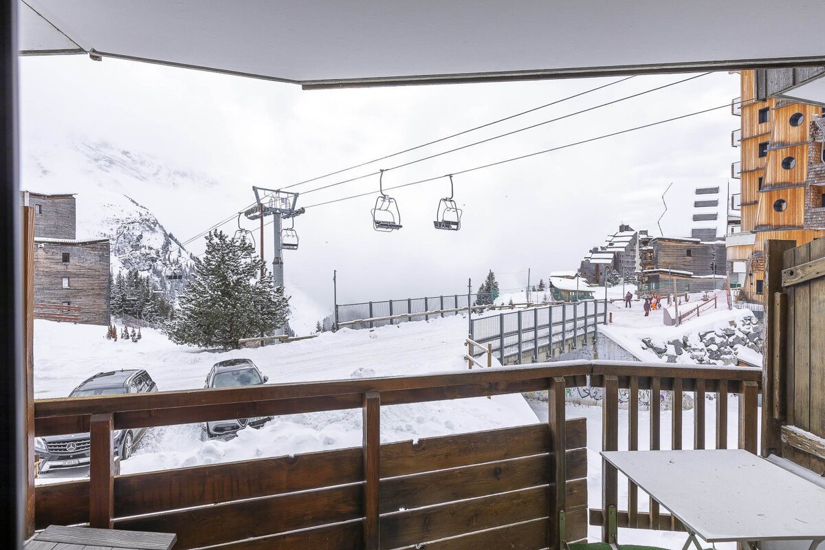 A view of a ski lift from a balcony