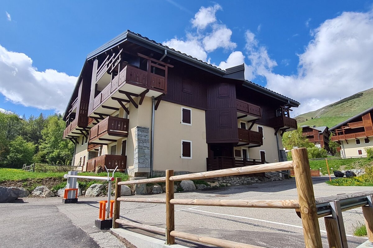 A building with a wooden fence in front of it