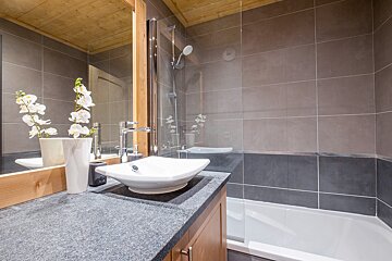 A bathroom with a sink and a bathtub