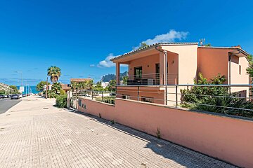 A house with a balcony on the side of it