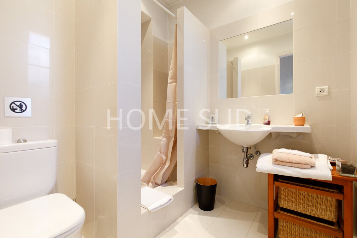 A bathroom with the word home on the wall