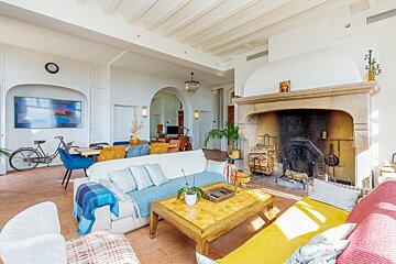 A living room filled with furniture and a fireplace