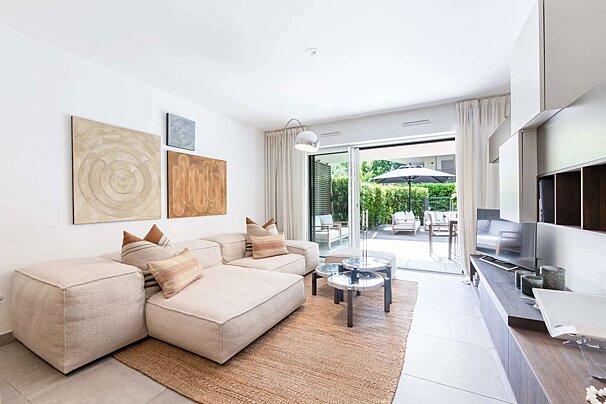 A living room with a couch and a television