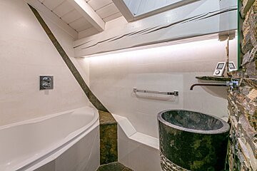 A bathroom with a bathtub and a sink