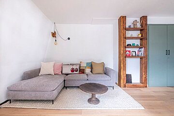 A living room with a couch and a coffee table