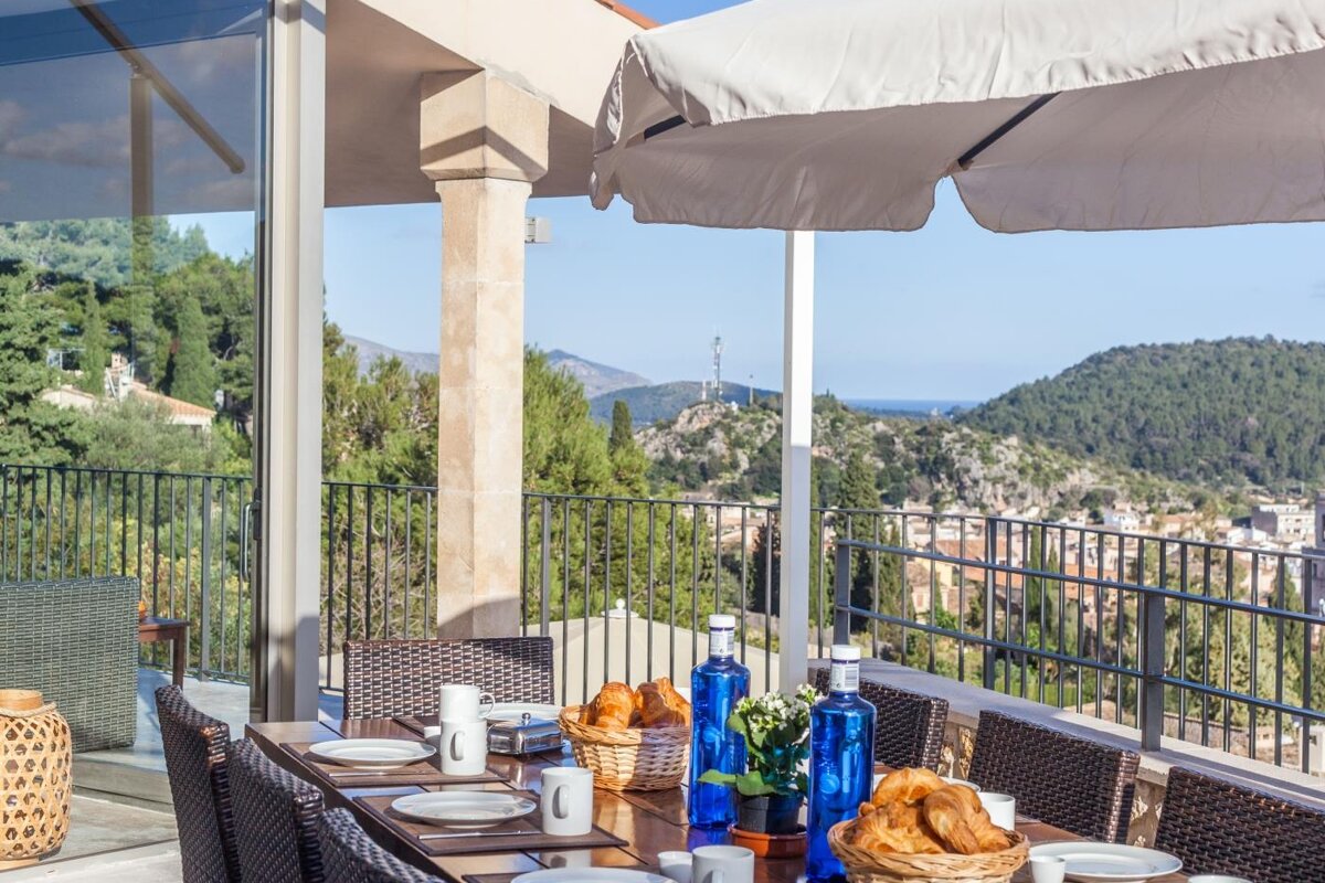 A table with plates and bottles of water on it