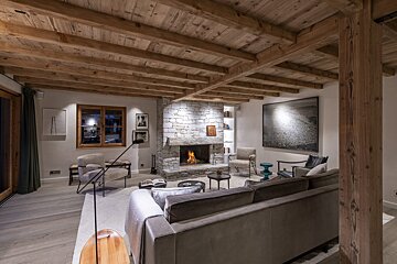 A living room with a fireplace and a couch