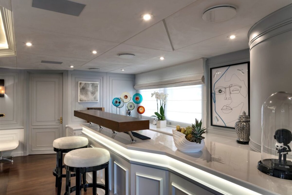 A bar with a painting of a face on the wall