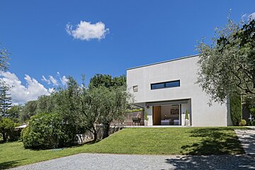 A white house with a large sliding glass door