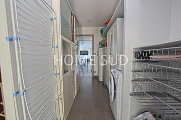 A laundry room with the words home sud on the wall