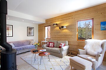 A living room with a couch and a chair