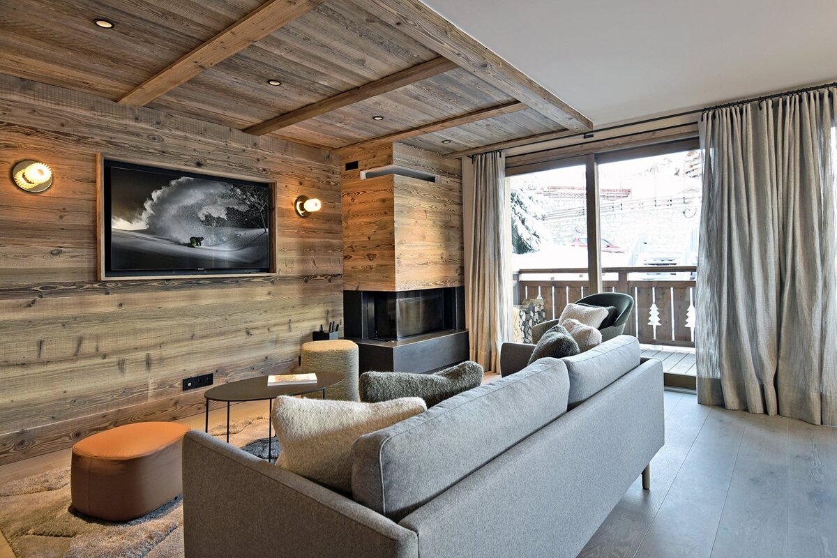 A living room with a couch and a flat screen tv