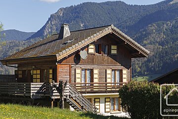 A house with a satellite dish on the roof