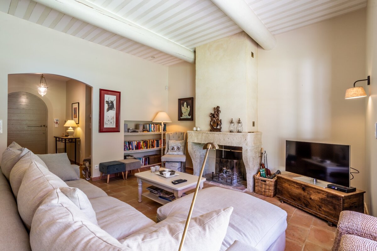 A living room with a fireplace and a couch