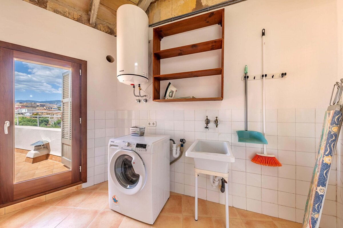A samsung washing machine sits in a laundry room
