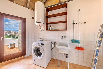 A samsung washing machine sits in a laundry room