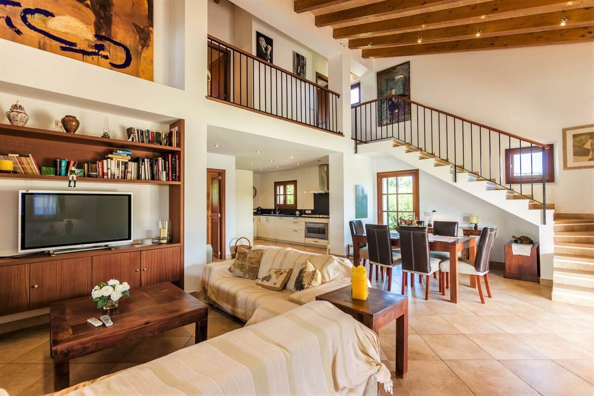 A living room with a couch and a flat screen tv