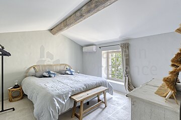A bedroom with the word france on the wall