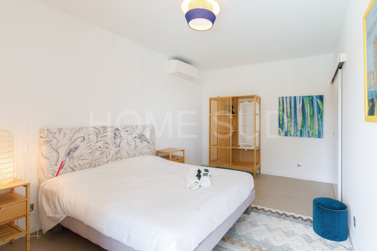 A bedroom with the word home on the wall