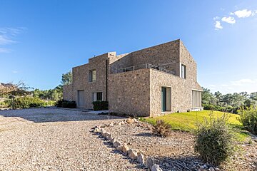 A stone building with a blue sky in the background