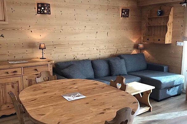 A living room with a couch and a table