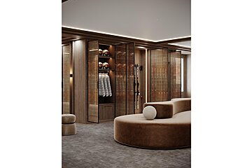 A room with a couch and a shelf with skis on it