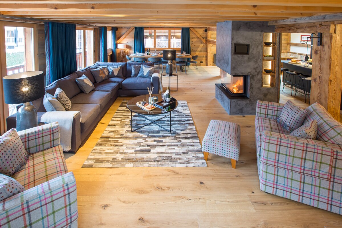A living room filled with furniture and a fireplace