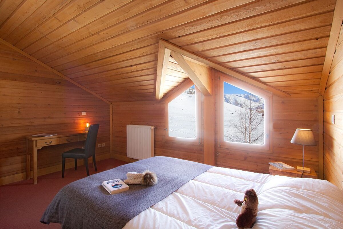 A bedroom with a bed and a book that says ' french ' on it