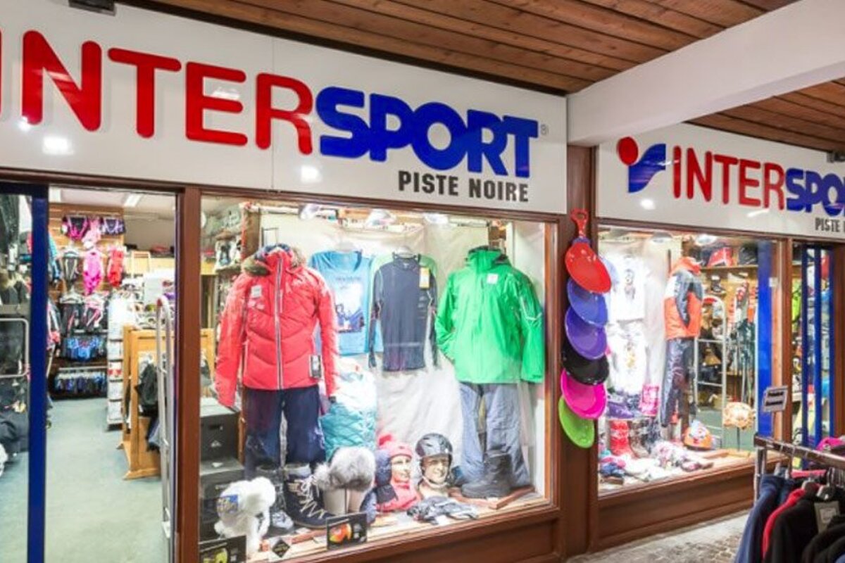 A store front for intersport piste noire with clothes on display