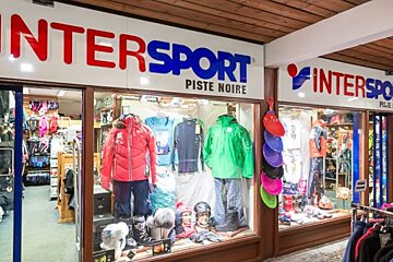 A store front for intersport piste noire with clothes on display
