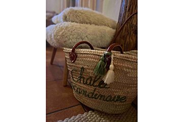A wicker basket with the word chale on it
