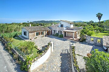 A house with a stone driveway leading to it