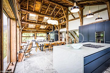 A kitchen with a large island in the middle of it
