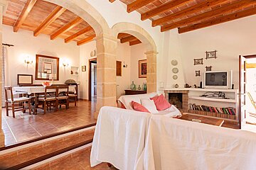 A living room with a fireplace and a flat screen tv