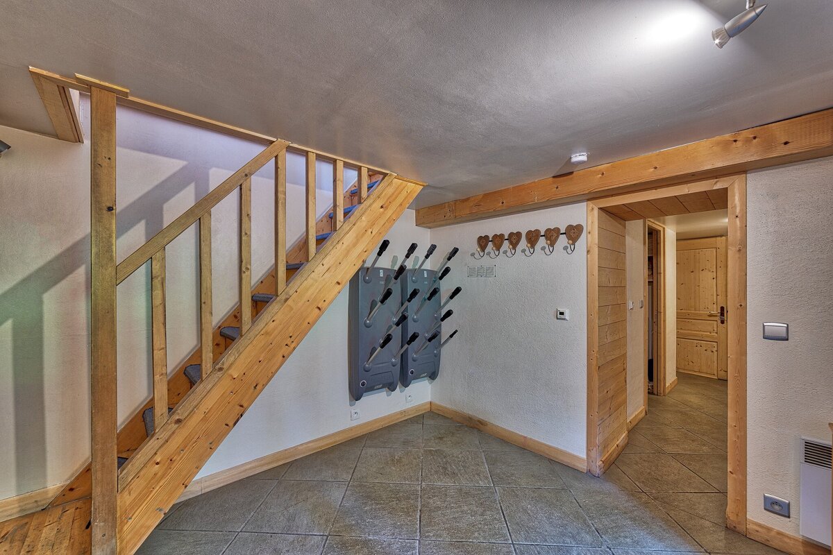 A wooden staircase leading up to the second floor
