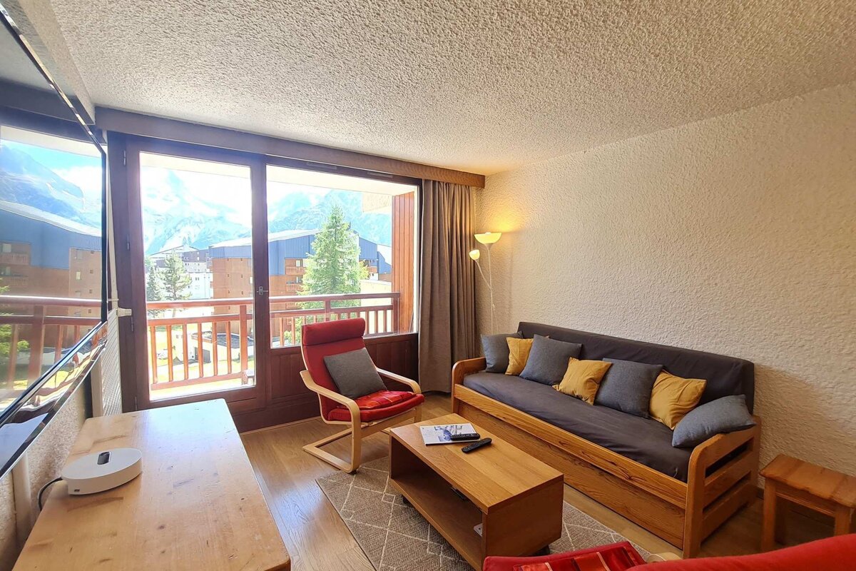 A living room with a couch and a chair